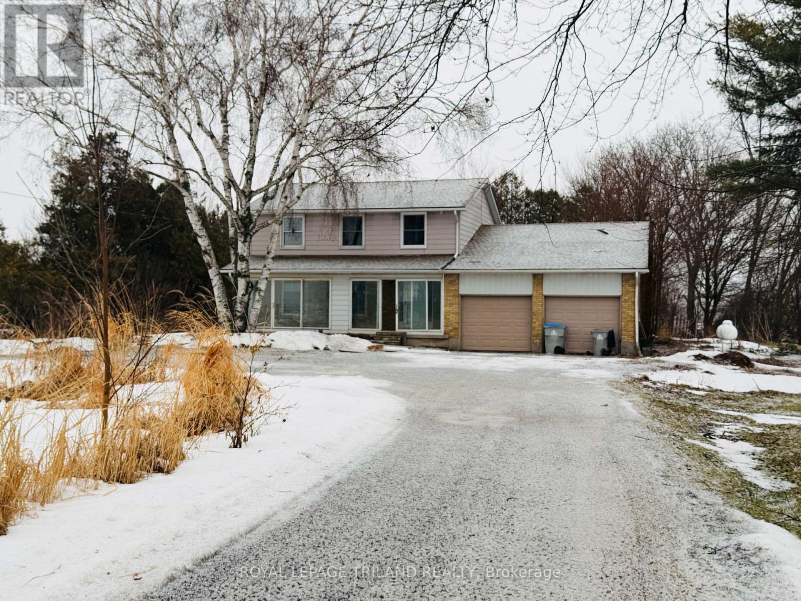 A house with a driveway in front of it.