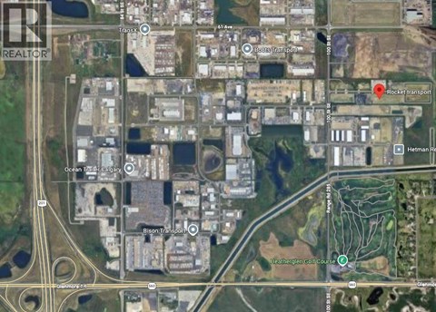 A satellite image of a city area with roads, buildings, and transportation hubs.