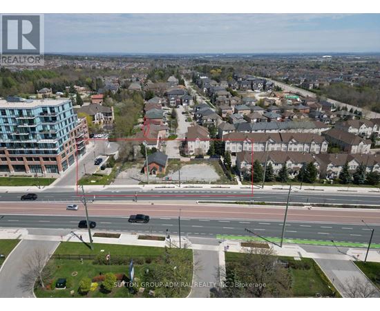 A real estate company logo is superimposed on a picture of a suburban street.