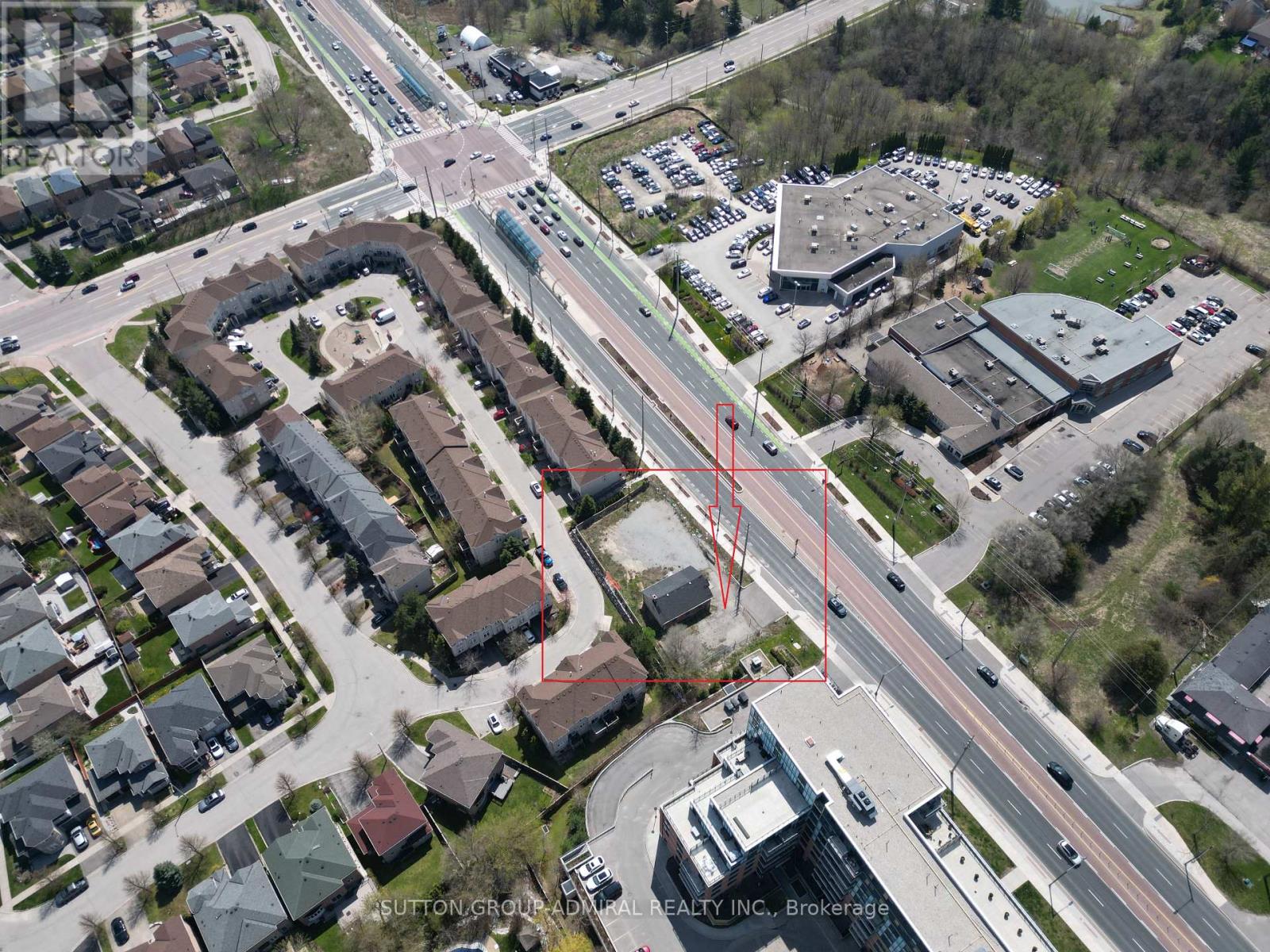 An aerial view of a neighborhood with a red line drawn across it.