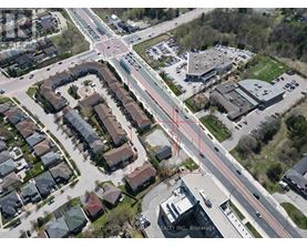 An aerial view of a neighborhood with a red line drawn across it.