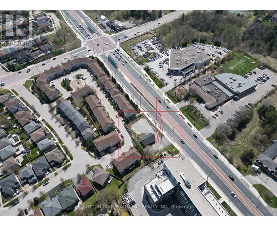 An aerial view of a neighborhood with a red line drawn across it.