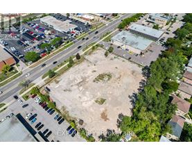 An aerial view of a parking lot with a large open area in the middle.