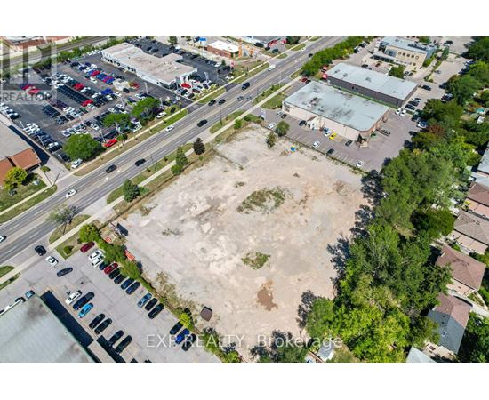 An aerial view of a parking lot with a large open area in the middle.
