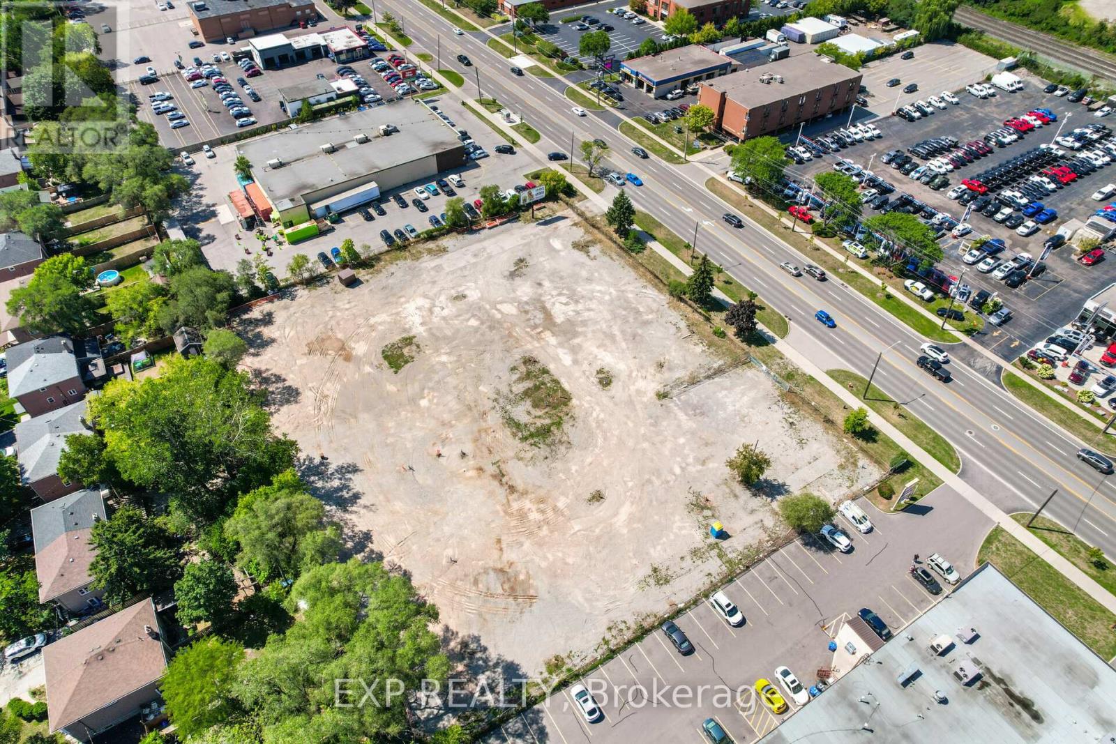 An aerial view of a parking lot with a large empty space in the middle.