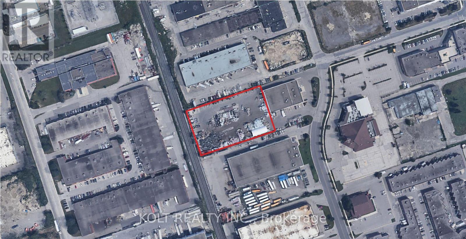 A satellite image shows a red outlined area in the middle of a city.