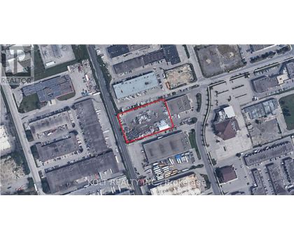 A satellite image shows a red outlined area in the middle of a city.
