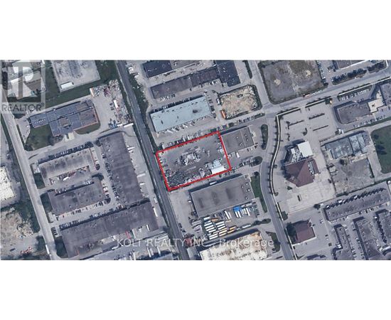 A satellite image shows a red outlined area in the middle of a city.