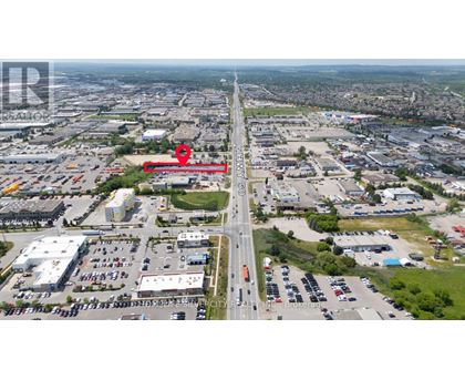 A red area is marked on a highway in the middle of a city.