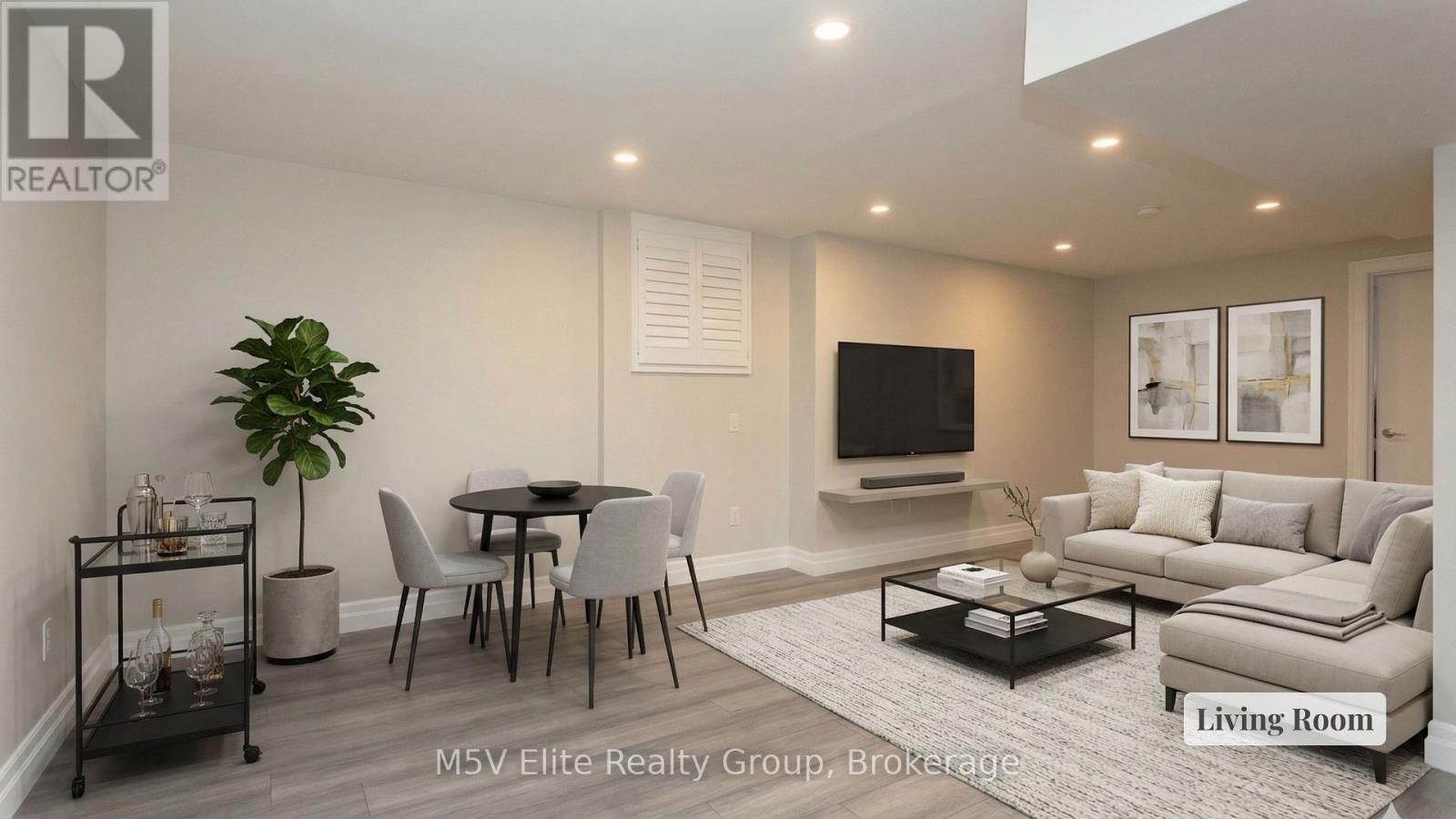 A living room with a dining table and chairs.
