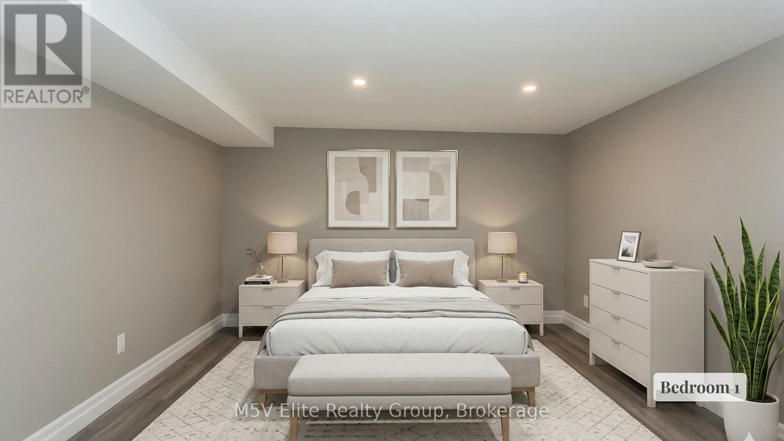 A bedroom with a large bed, two nightstands, and a plant.