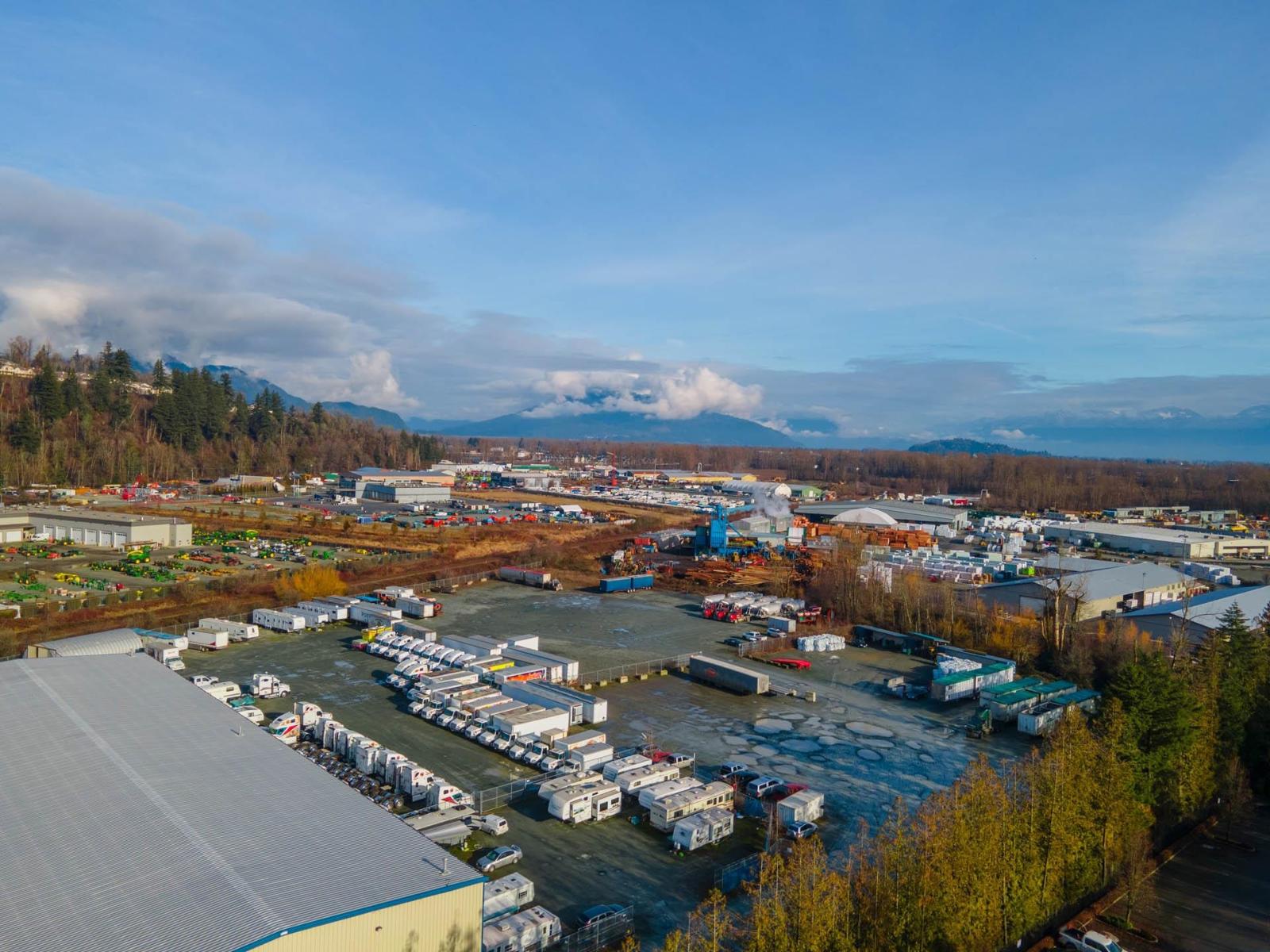 A large industrial area with a parking lot and buildings.