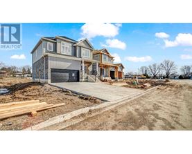 A house under construction with a clear sky in the background.