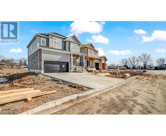 A house under construction with a clear sky in the background.