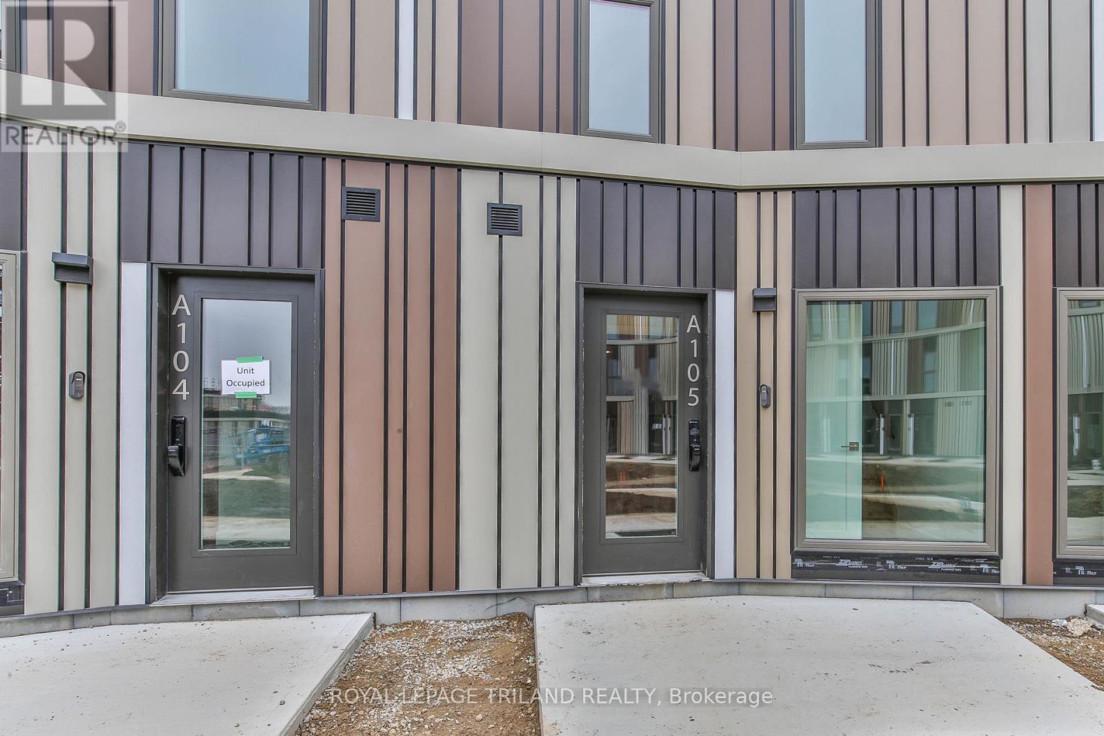 The image shows the front of a building with doors numbered 101 and 105.