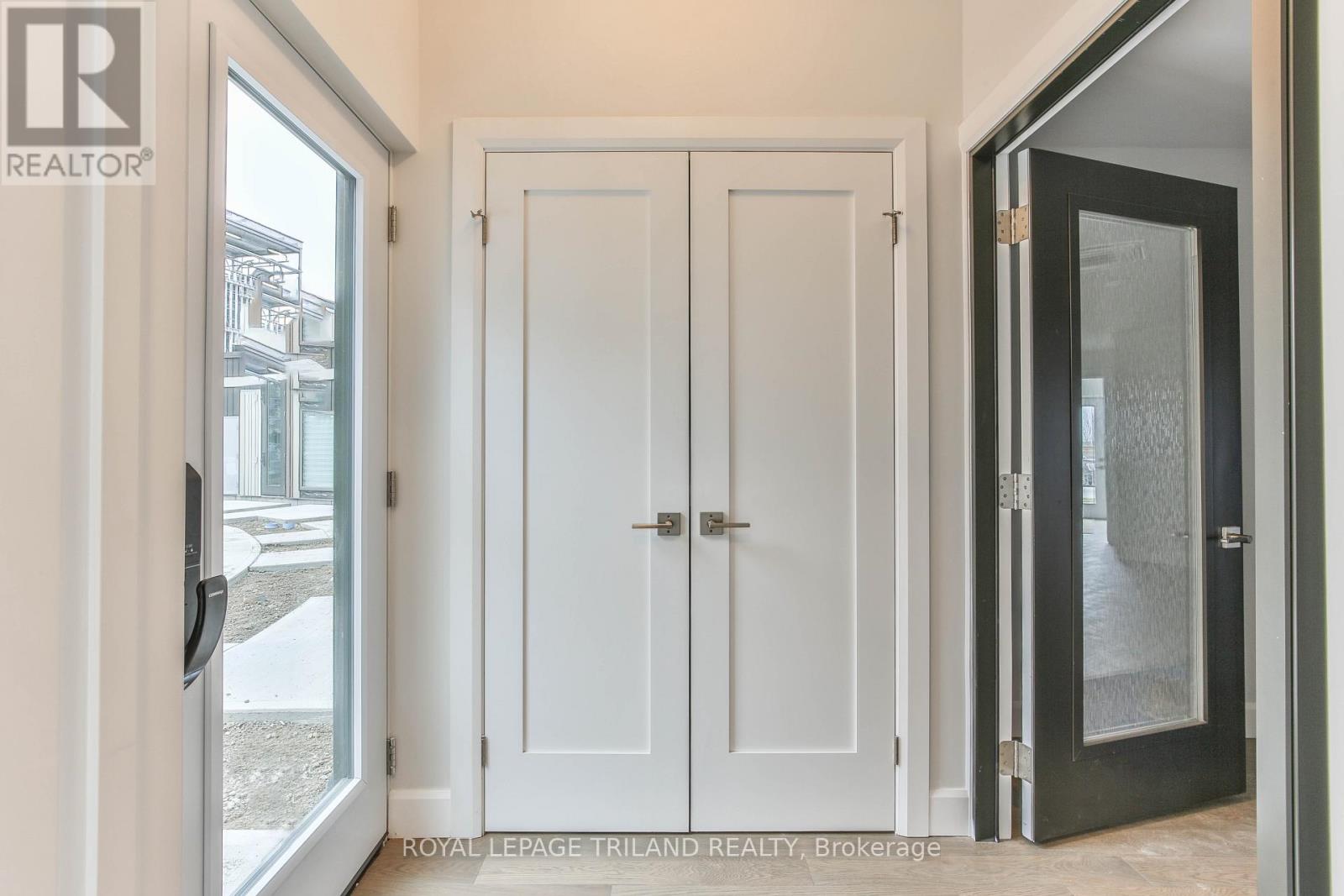 A white door with a glass window is on the left side of the image.