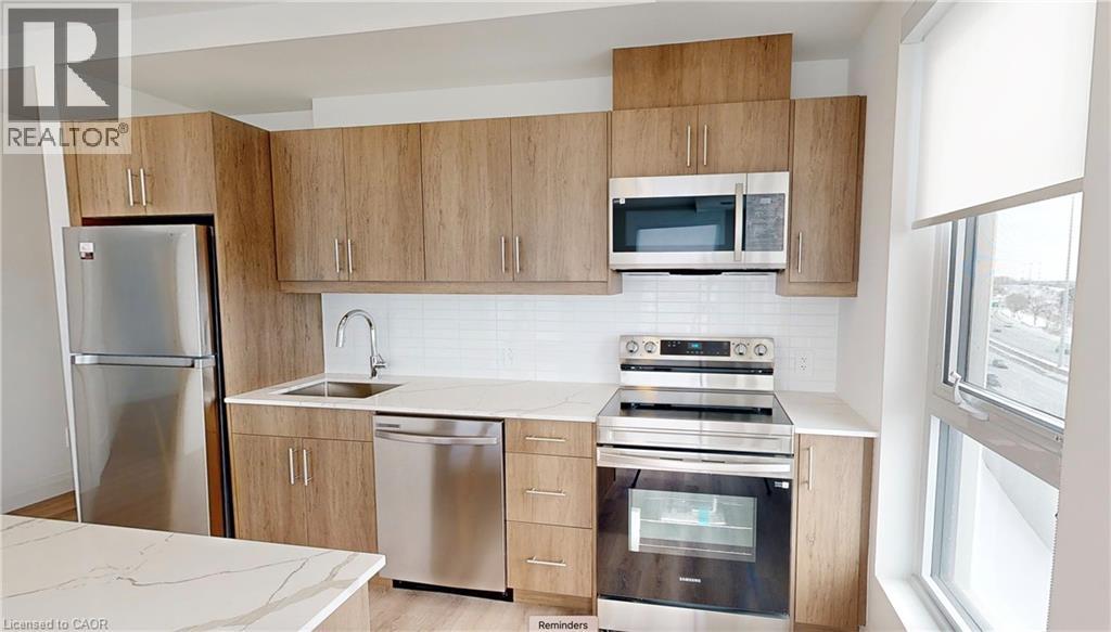 A kitchen with wooden cabinets and stainless steel appliances.