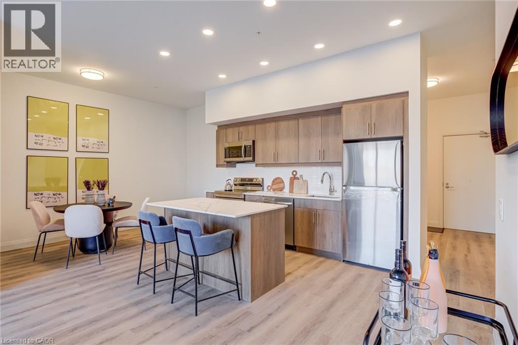 A modern kitchen with a dining table and chairs.
