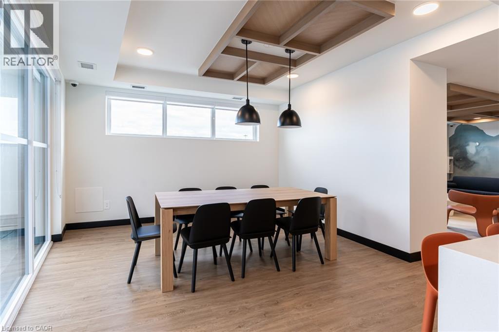 A conference room with a long table and chairs.