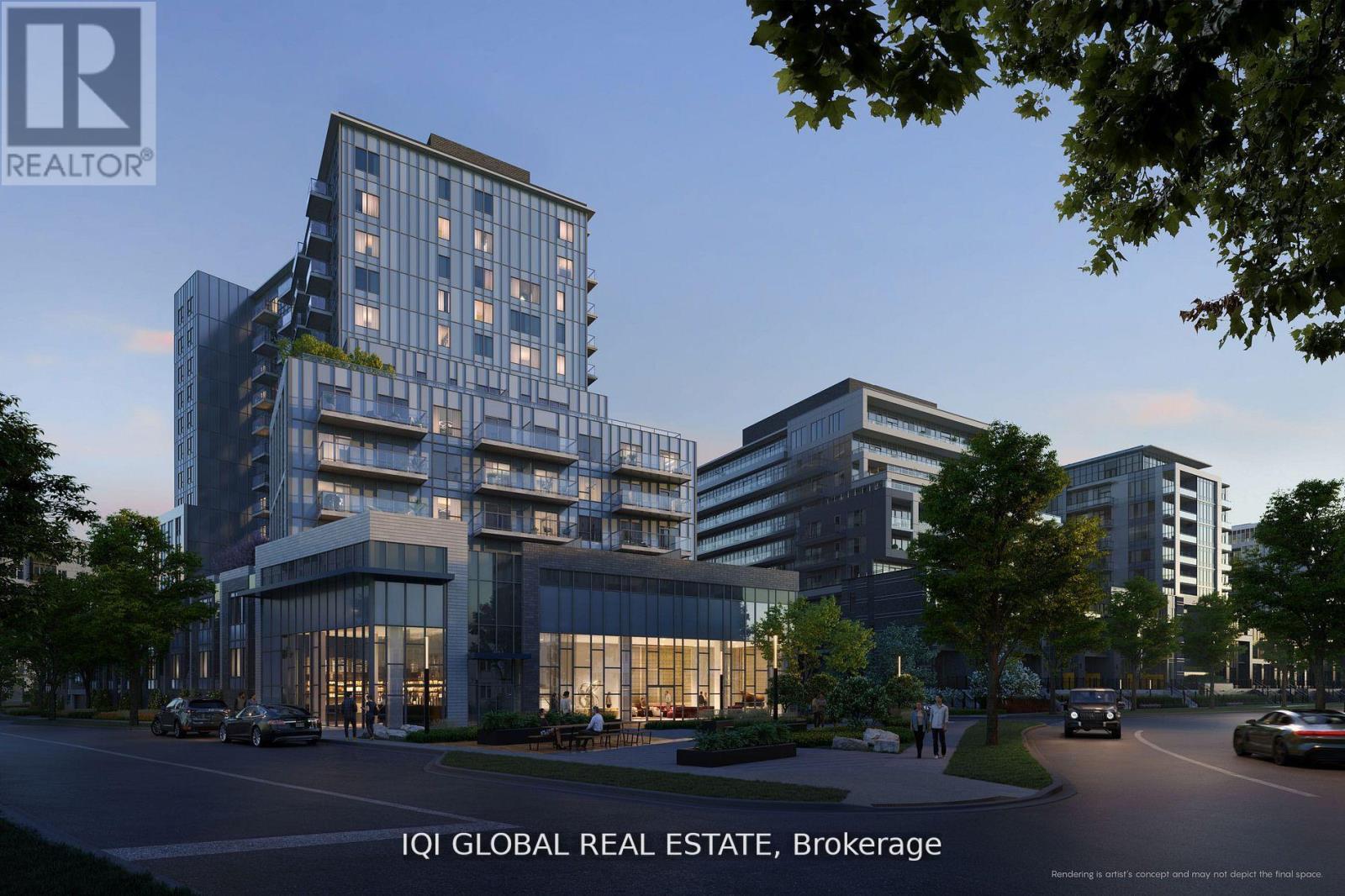 A modern multi-story building with a glass facade is the focal point of the image.