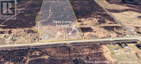 An aerial view of a property for lease, surrounded by a yellow line.
