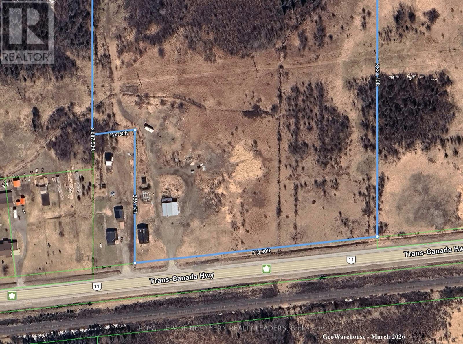 A satellite image shows a large brown area with a blue line running through it and a green line on the left side.