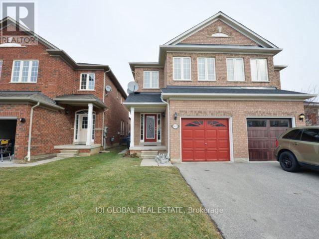 A house with a red garage door is for sale.