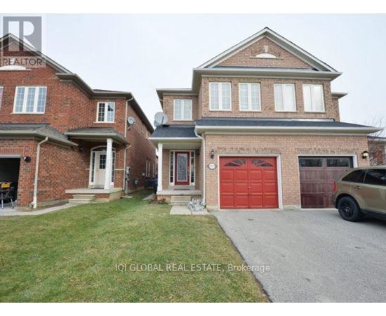A house with a red garage door is for sale.