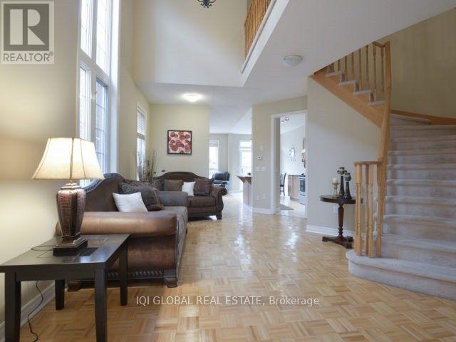 A living room with a brown couch and a wooden table.