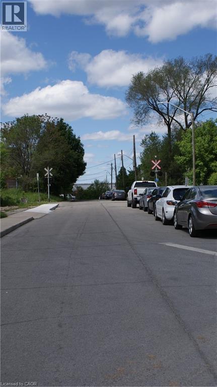 Cars are parked on the side of the road.