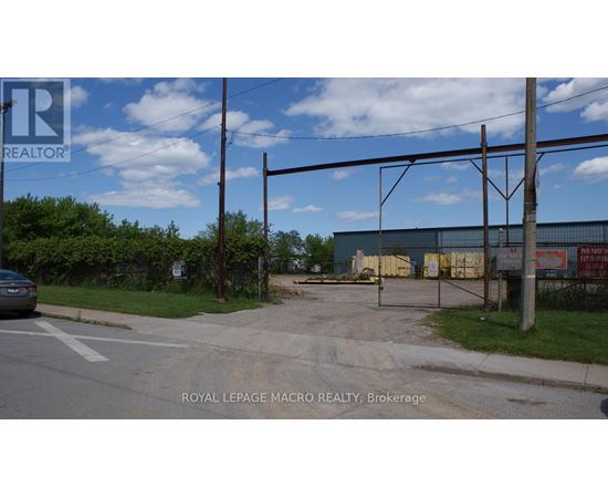 A large building with a fence in front of it.