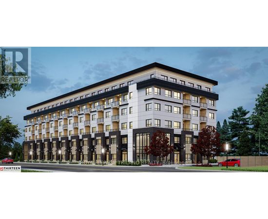 A modern multi-story apartment building with balconies and large windows.