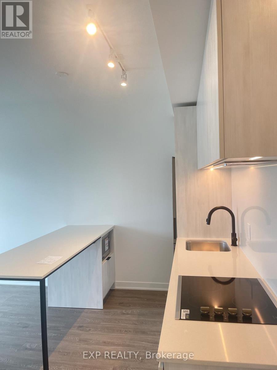 A modern kitchen with a sink and a counter.