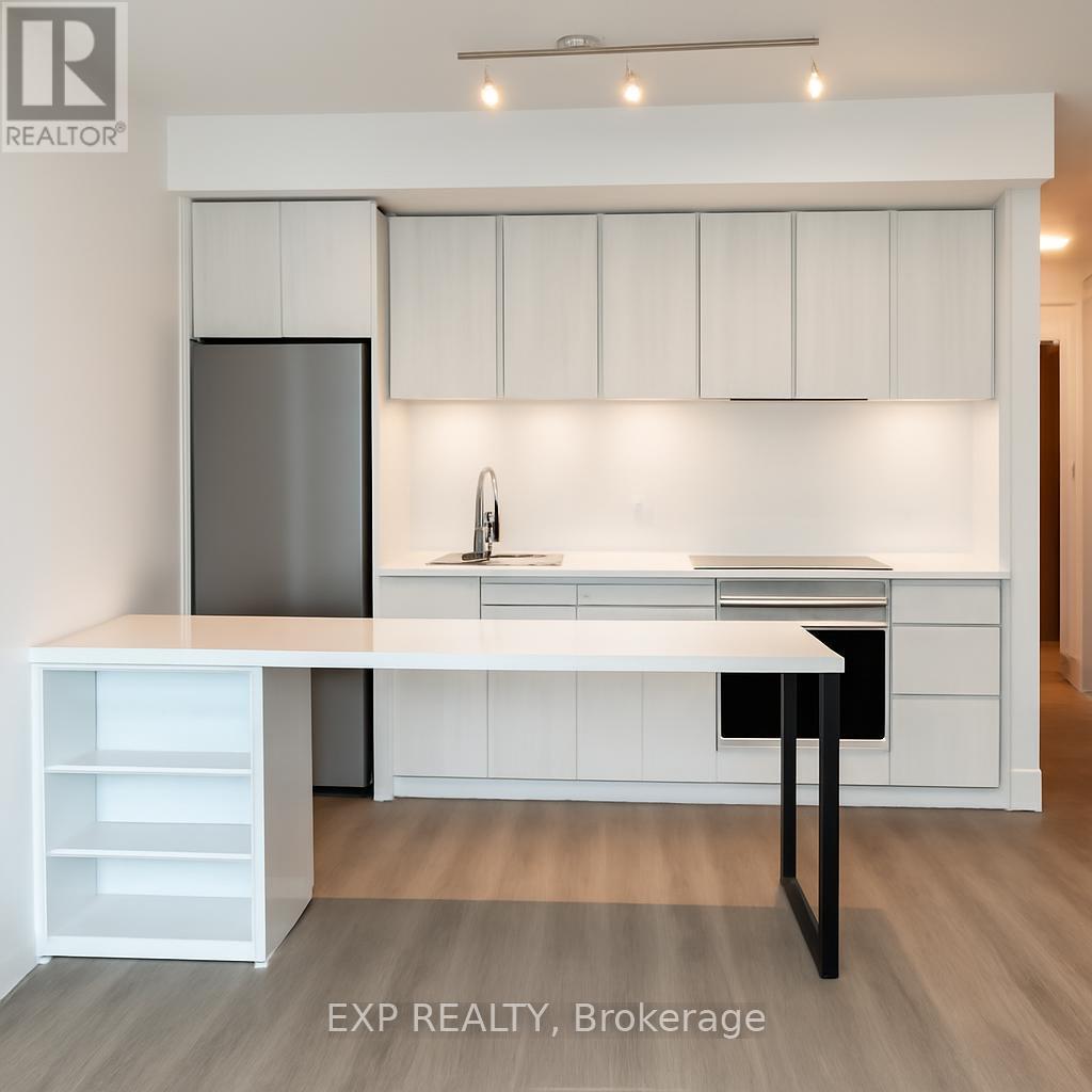 A white kitchen with a table and chairs.