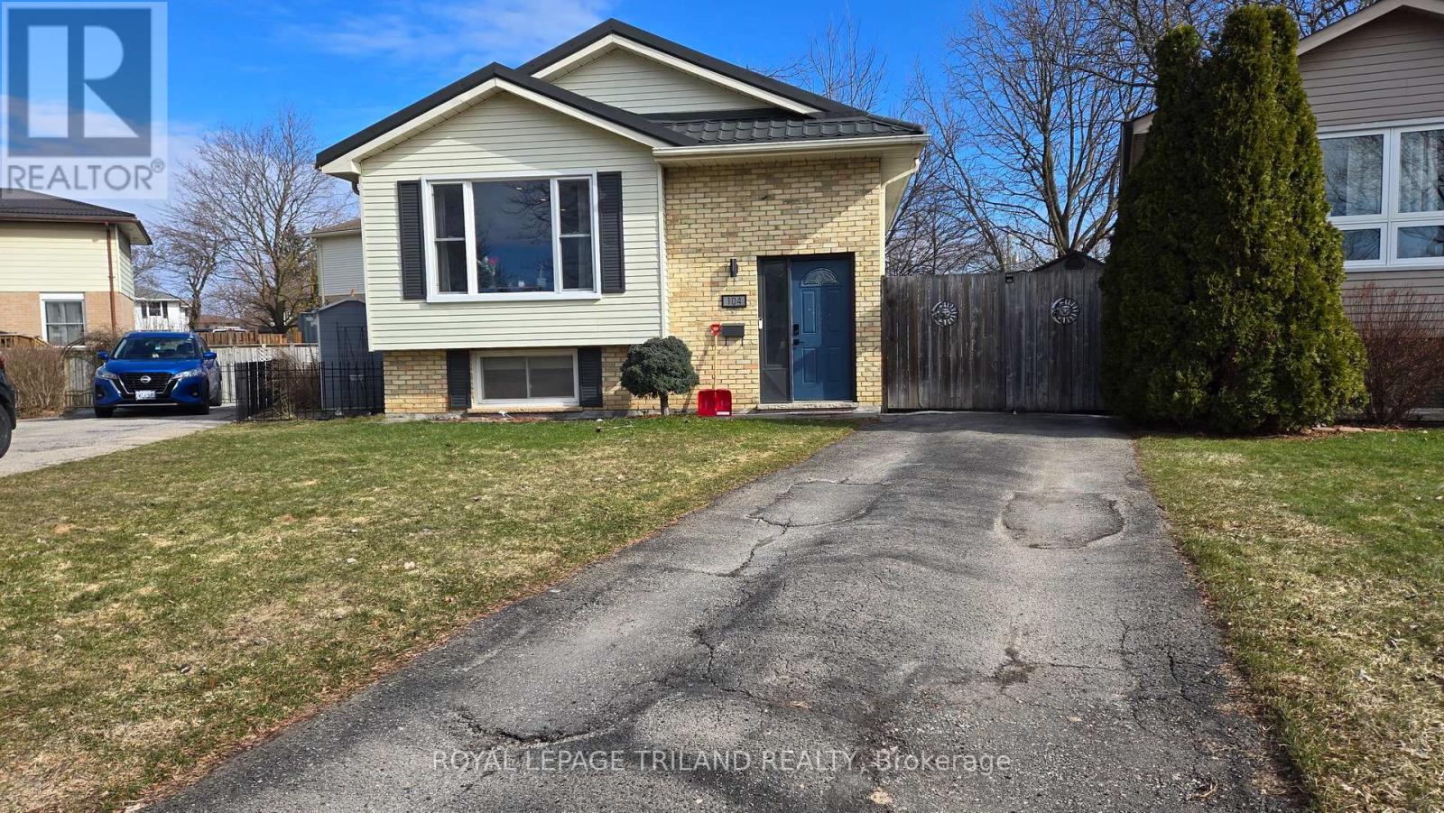 A house with a driveway in front of it.