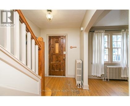 A room with a wooden door and a radiator.