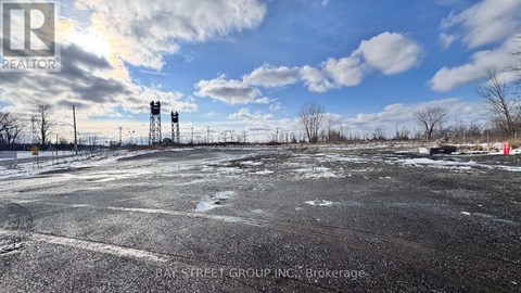 A parking lot with a sign that says "Bay Street Group Inc. Brokerage.".