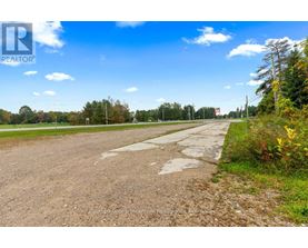 A road with a sign that says REALTOR in the distance.