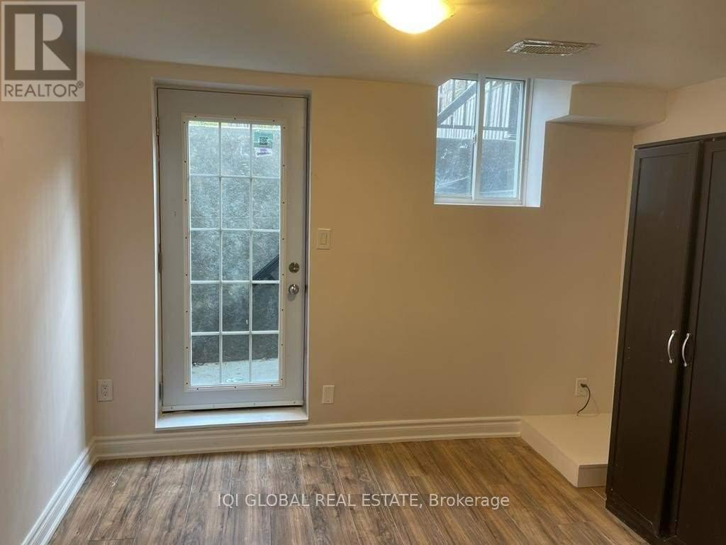 A room with a door and a window.