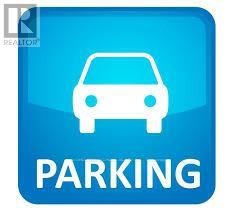 A blue parking sign with a white car symbol.