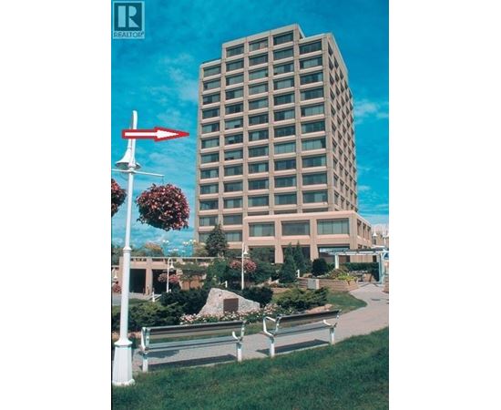 A tall building with a red arrow pointing to the left.