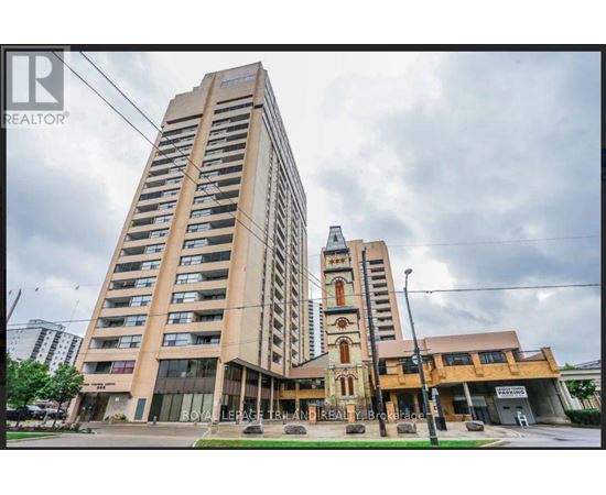 A tall building with a sign that says "REALTOR" on it.