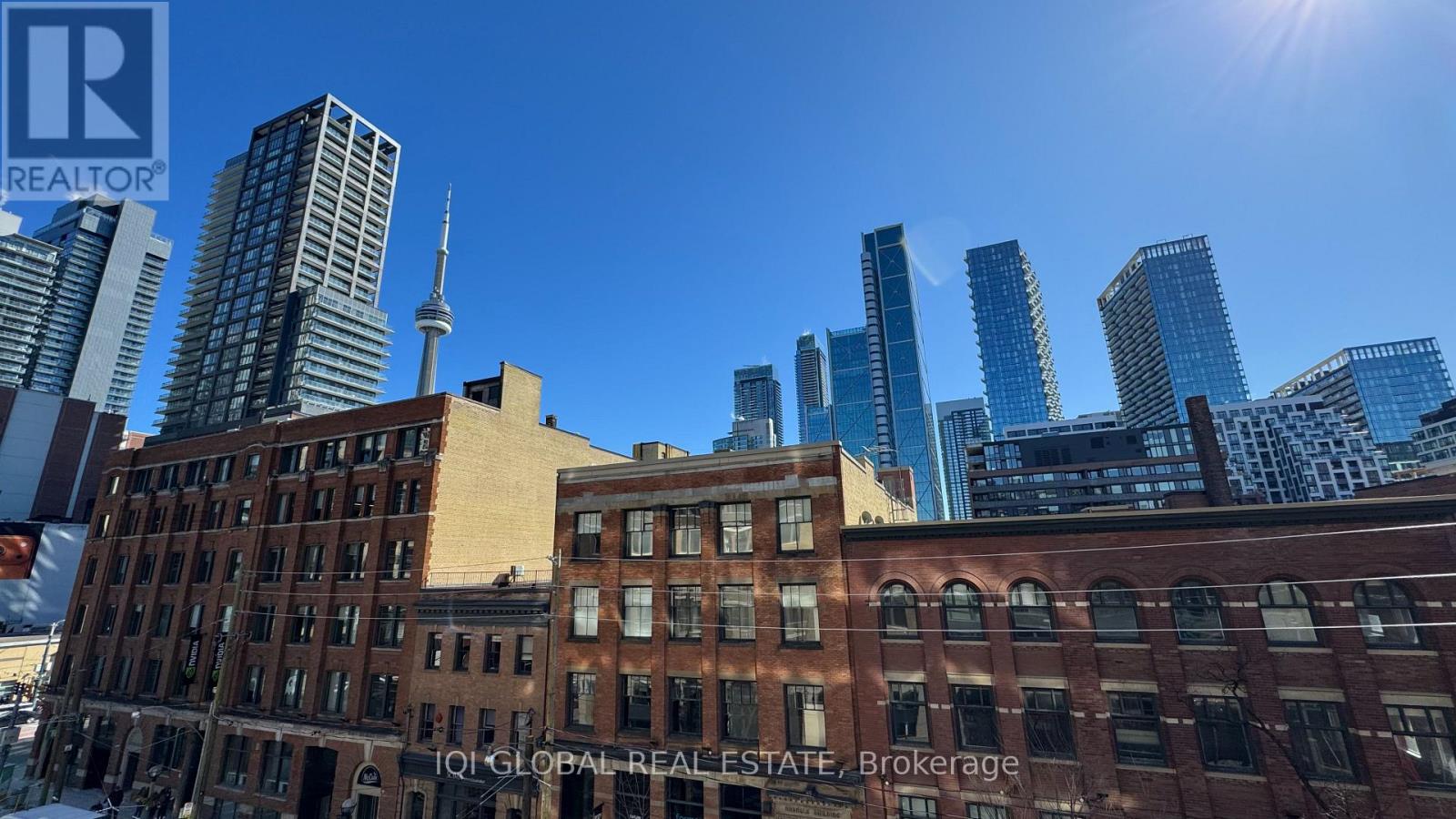 A cityscape with a mix of modern and older buildings.