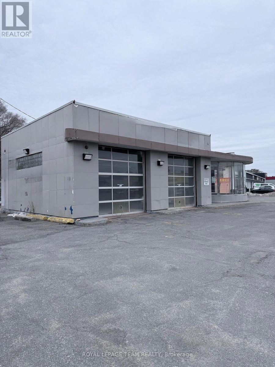 A grey building with a sign that says "REALTOR" on it.