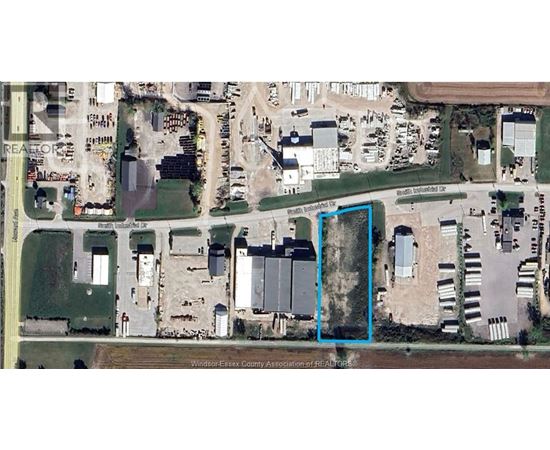 A satellite image shows a large building complex with a parking lot in front.