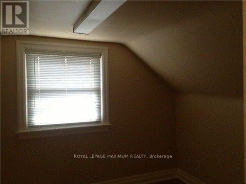A room with a window and a logo that says "REALTOR".
