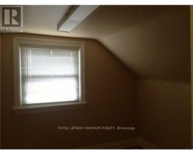 A room with a window and a logo that says "REALTOR".