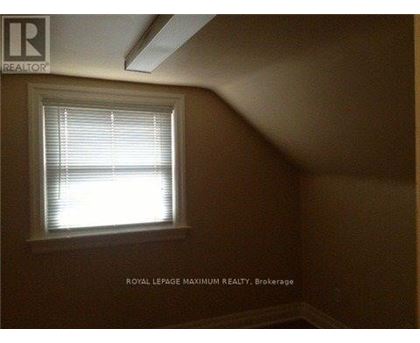 A room with a window and a logo that says "REALTOR".