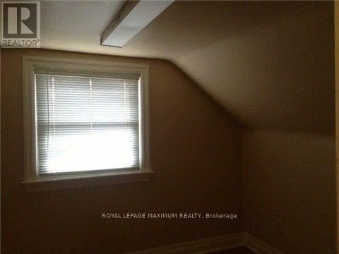 A room with a window and a logo that says "REALTOR".