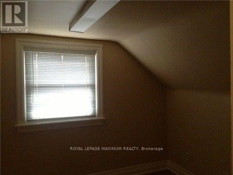 A room with a window and a logo that says "REALTOR".